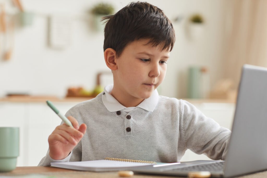 Cute Boy Studying at Home